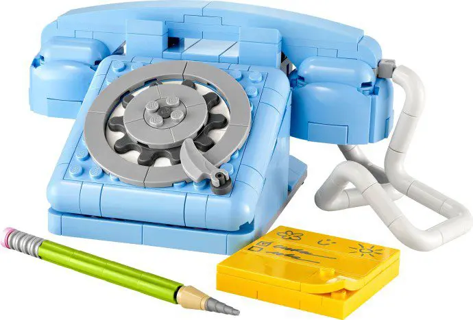 Blue toy rotary phone with pencil