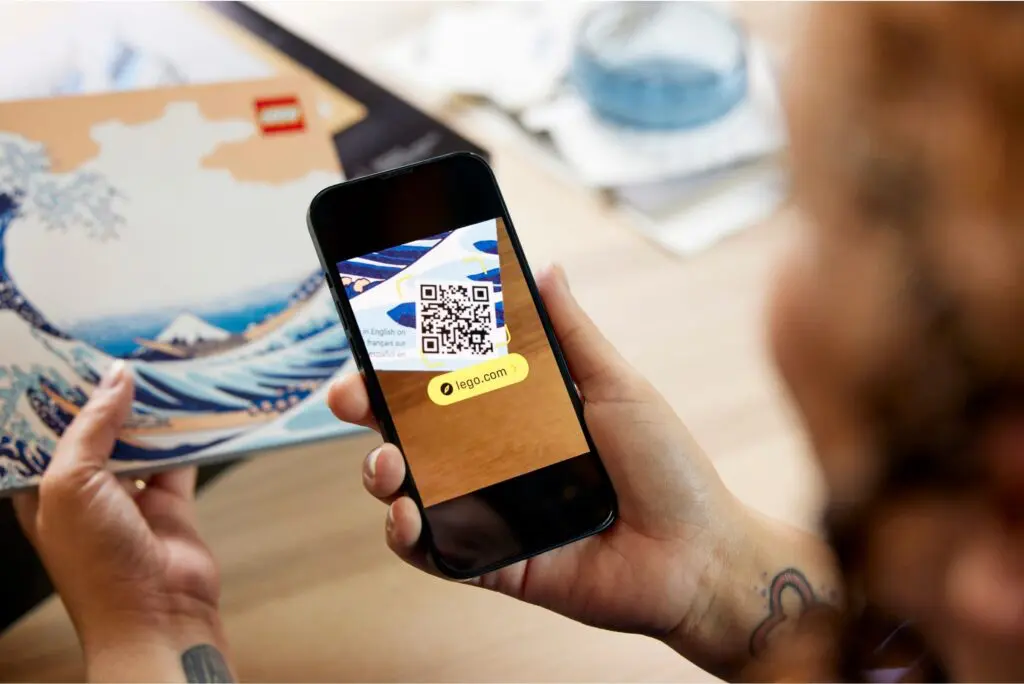 QR code on phone screen near book