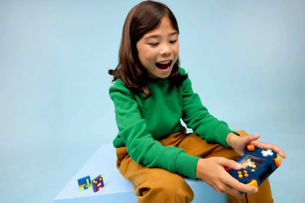 Child playing with handheld game console