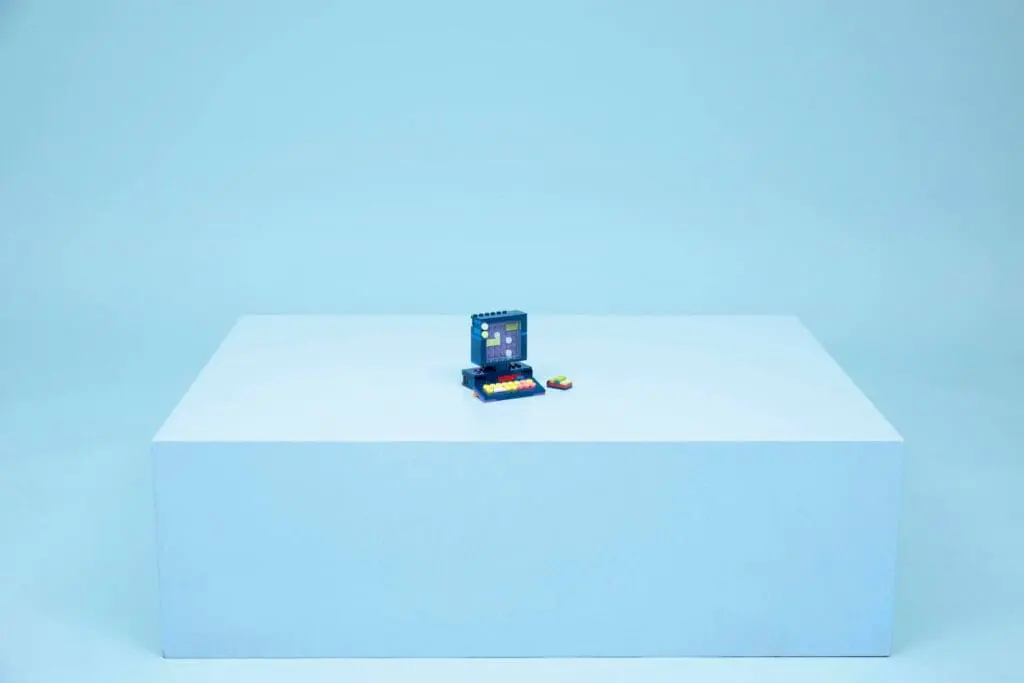 Miniature arcade game on blue pedestal