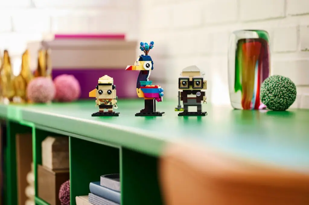 Three Lego models on stylish shelf