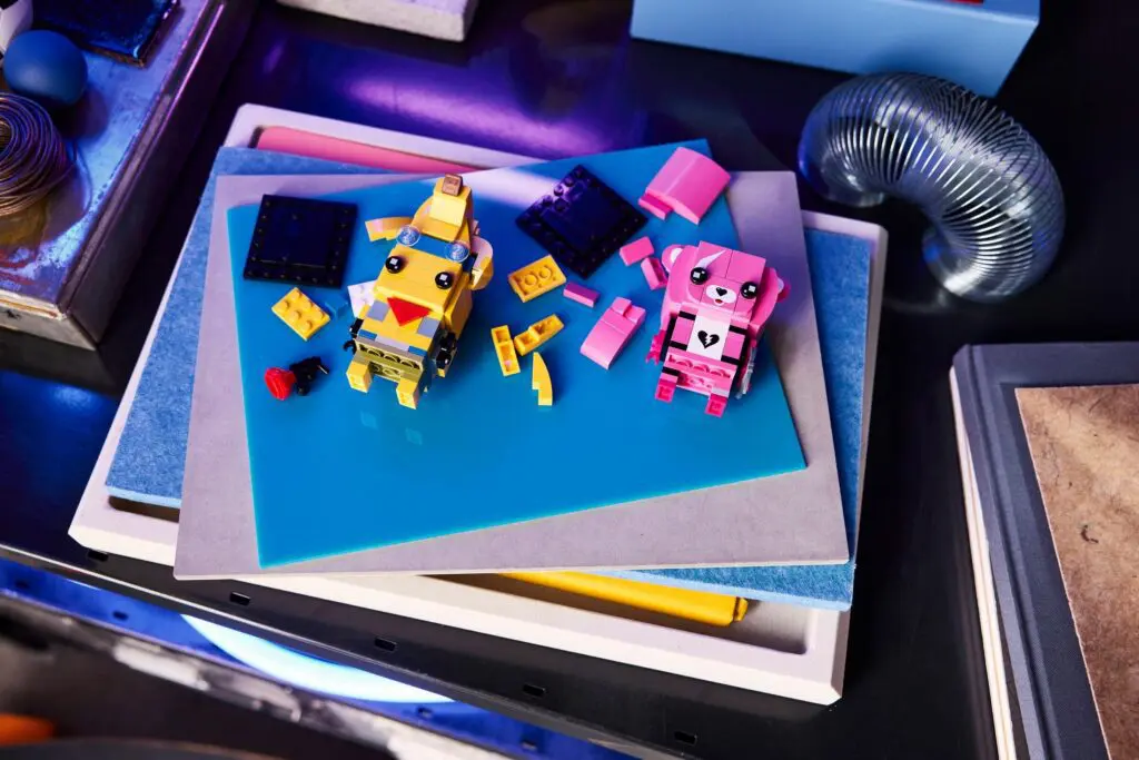 Small pink and yellow robot toys