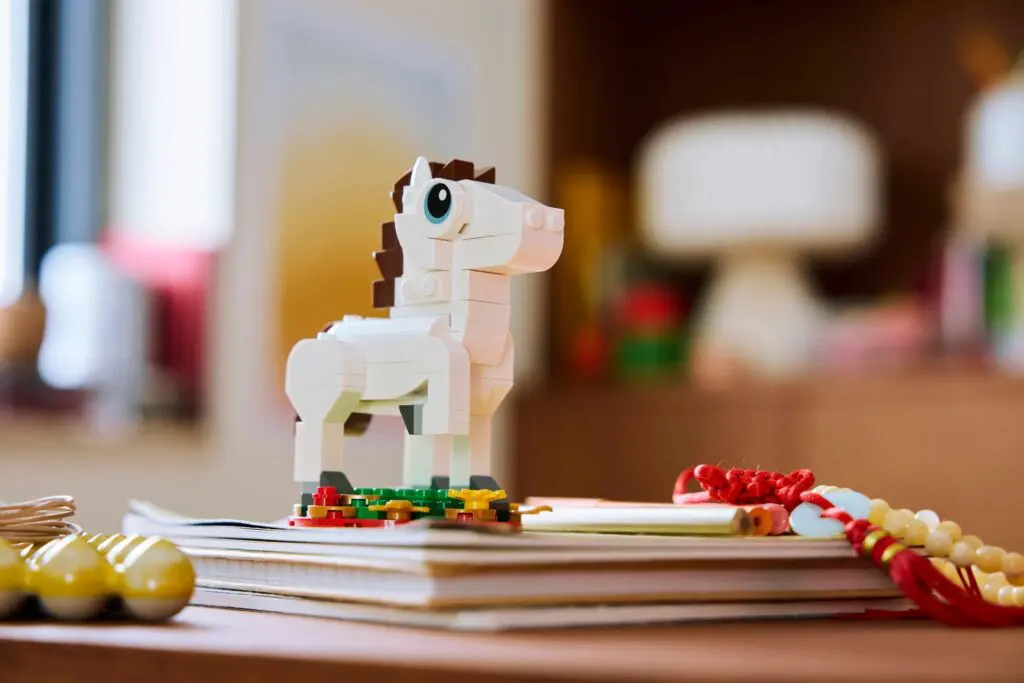 Lego horse figurine on desk
