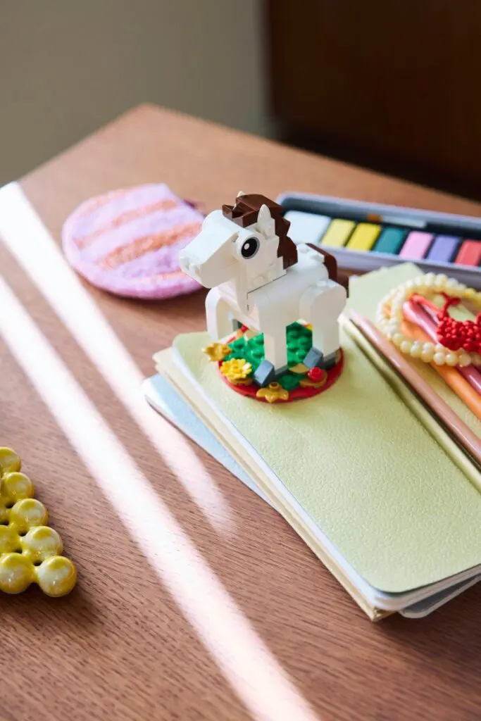 Toy horse on wooden desk