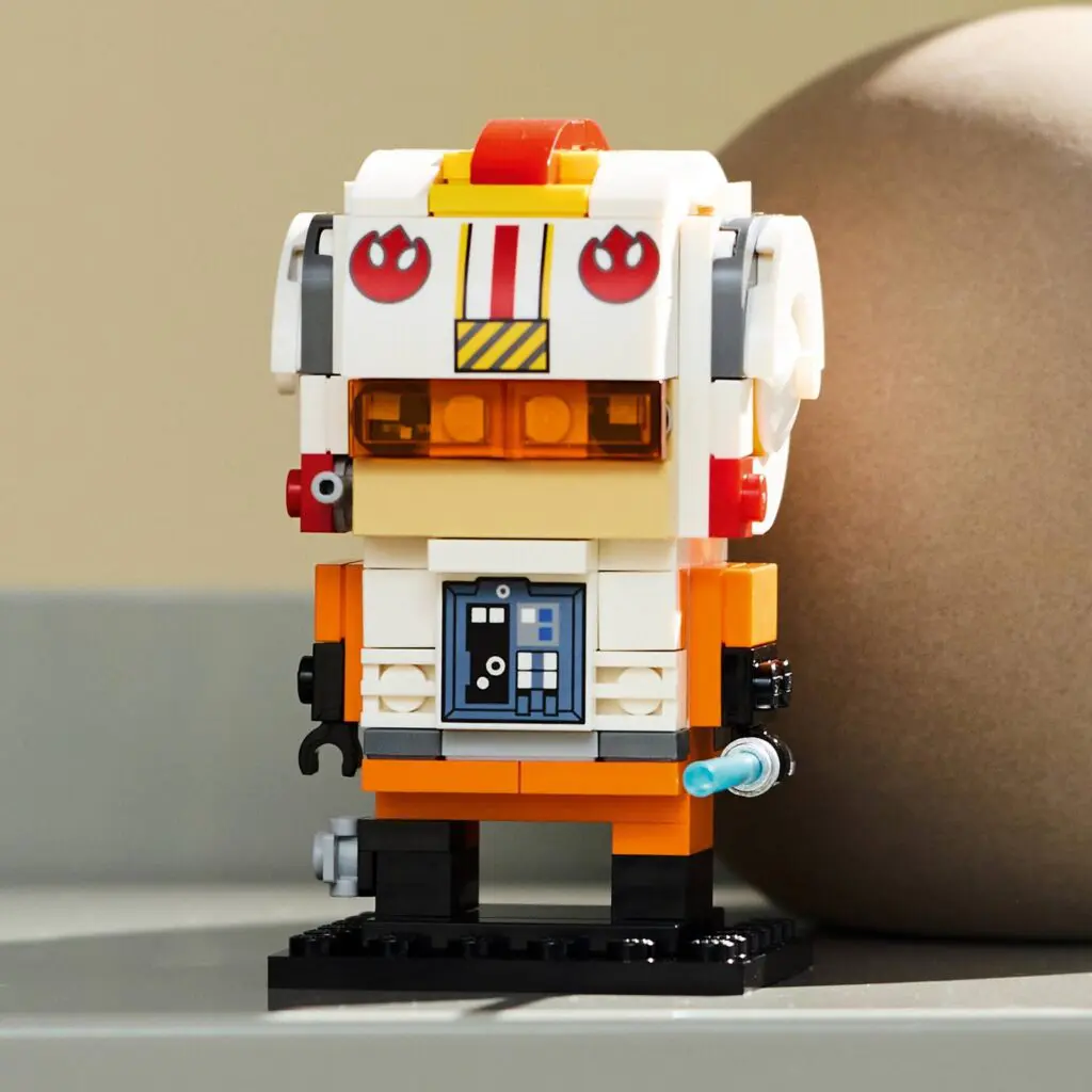 Colorful LEGO character in orange uniform