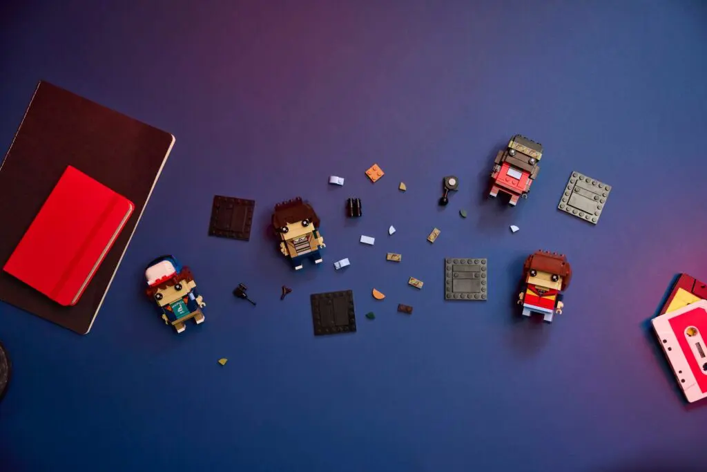 Colorful figurines with small parts on surface