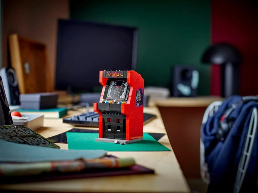 Desk with small arcade game setup