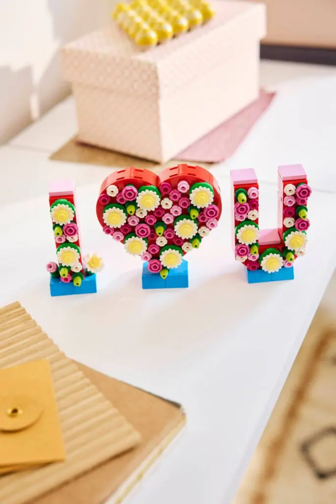 Decorative letters with flowers on table