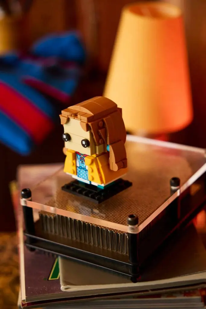 Toy figurine on stacked books