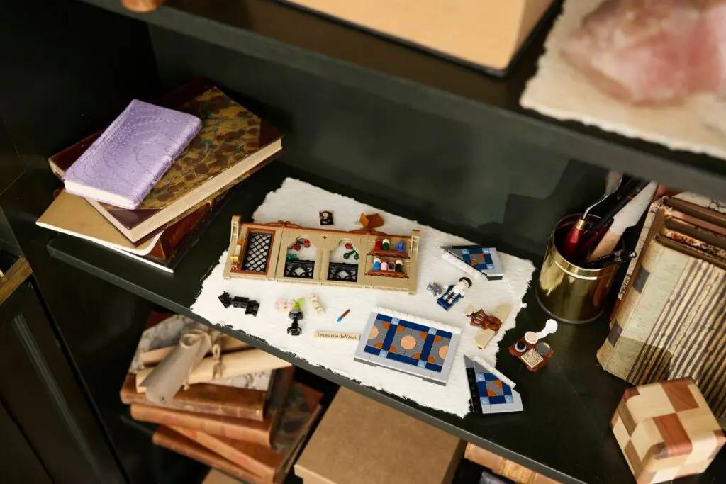 Miniature dollhouse furniture and accessories on shelf