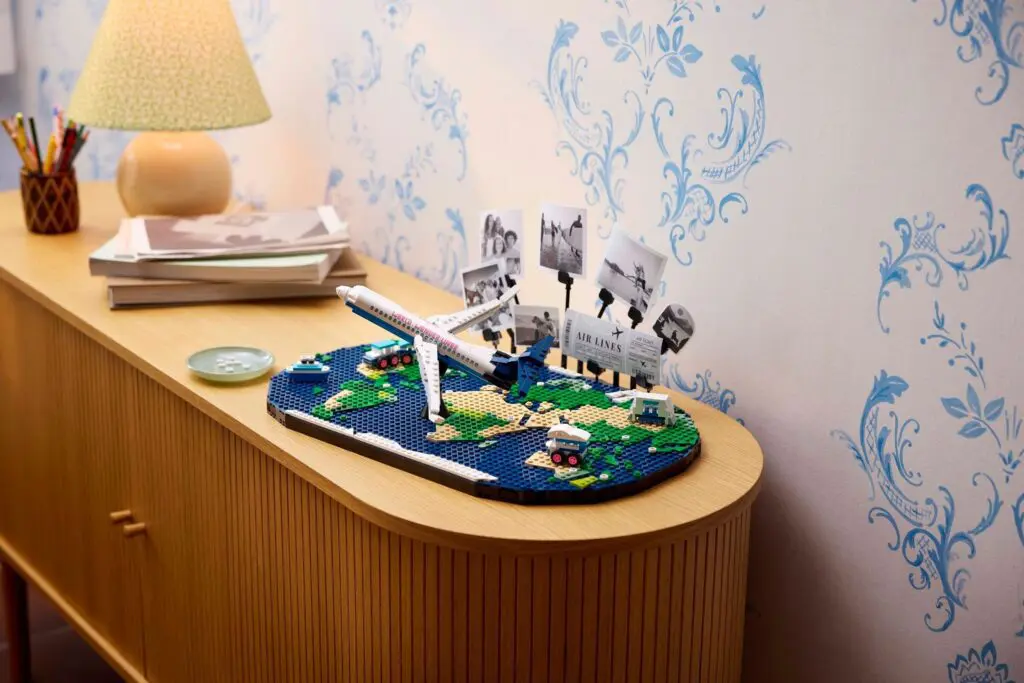 Airplane diorama with globe and photos