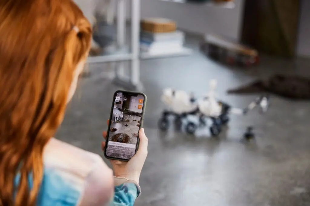 Person using phone to control robot