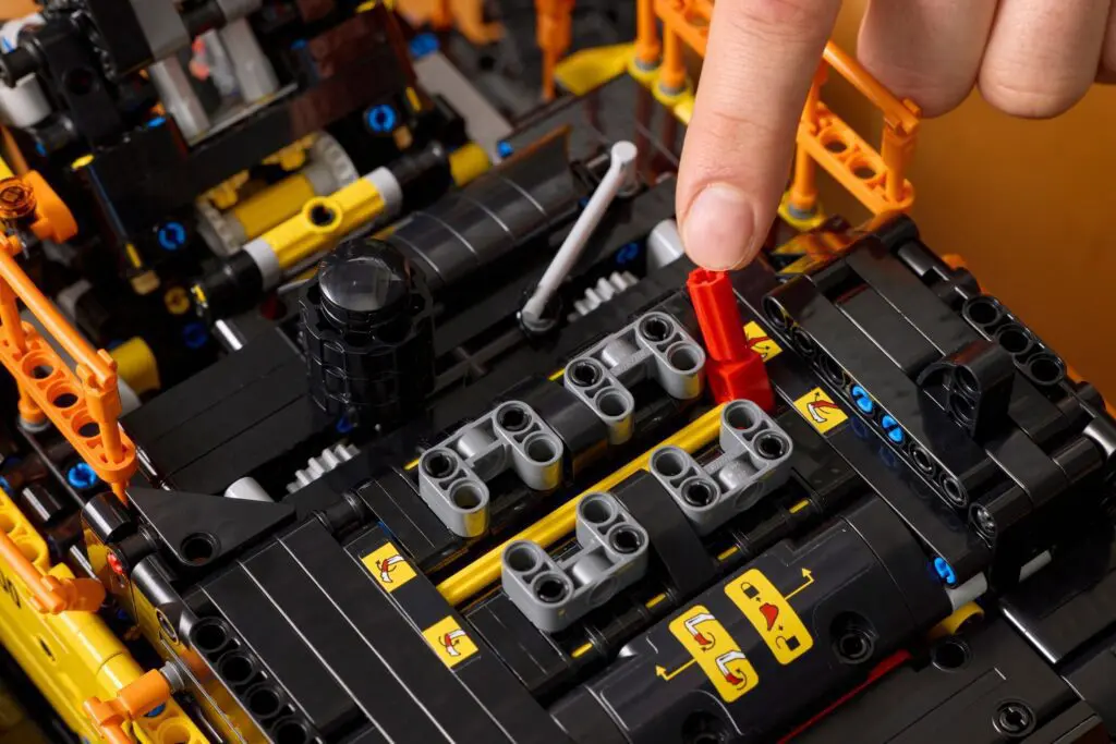 Close-up of LEGO Technic engine assembly.