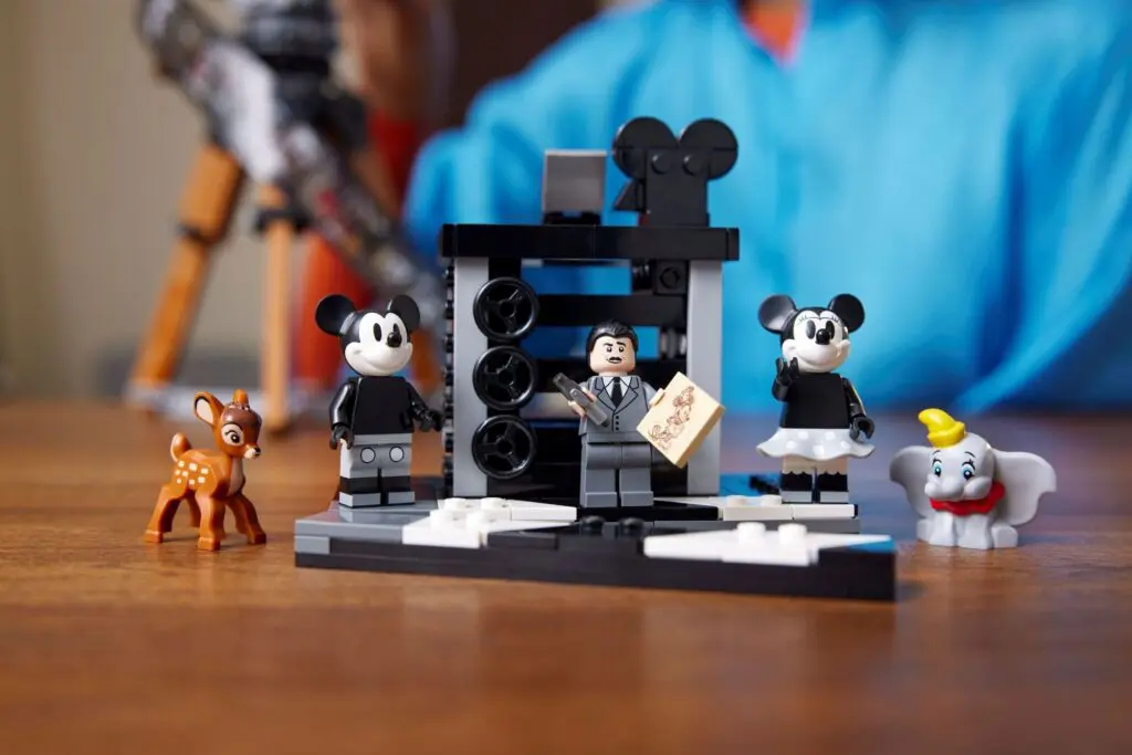 Lego Disney characters on a wooden table.
