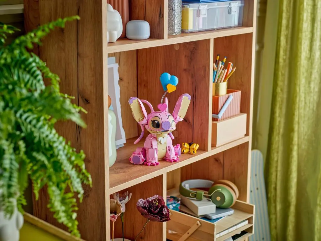 Decorative toy and plant on shelf