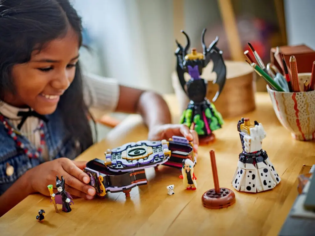 Child playing with colorful toy figures