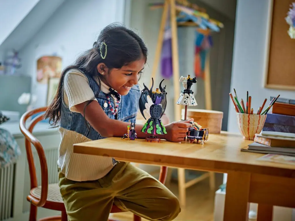 Smiling child engaged with toys indoors