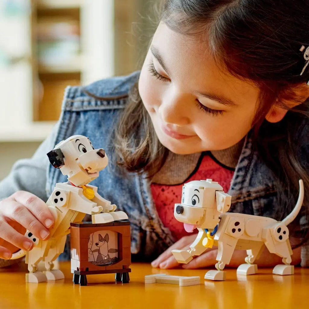 Child playing with Dalmatian dog toys