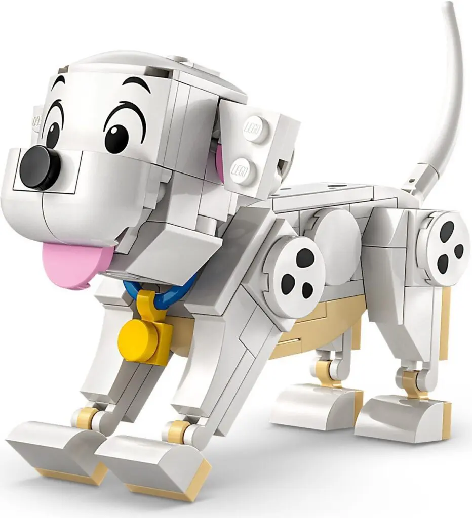 White brick dog with wagging tail