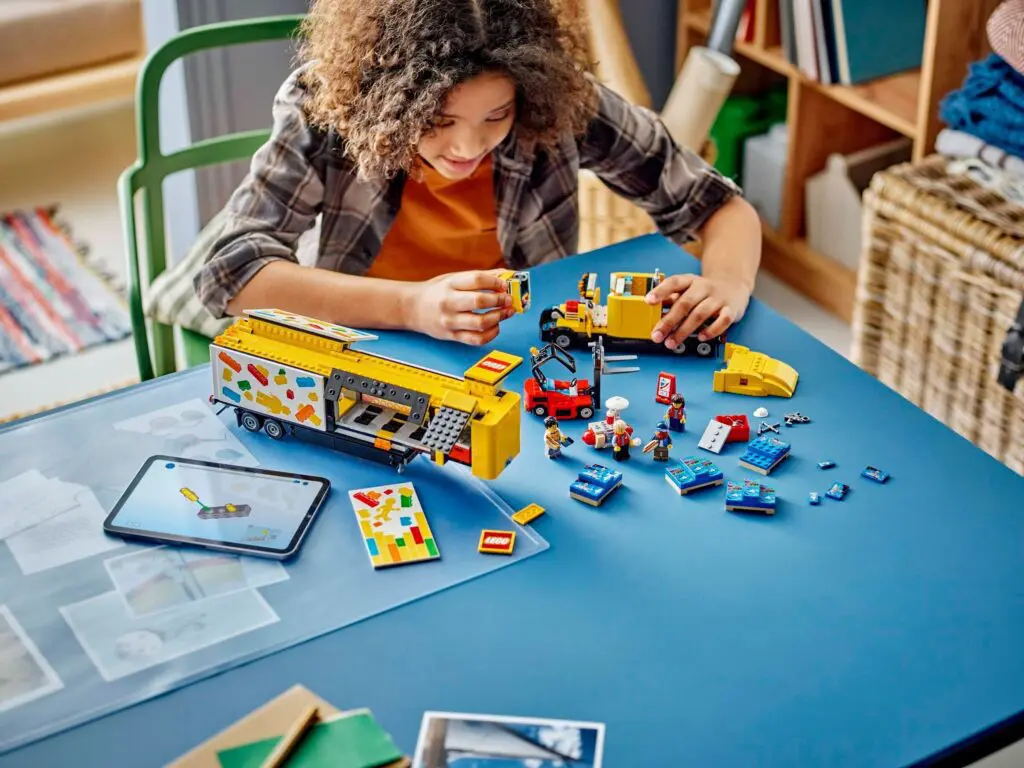 Child playing with colorful building blocks