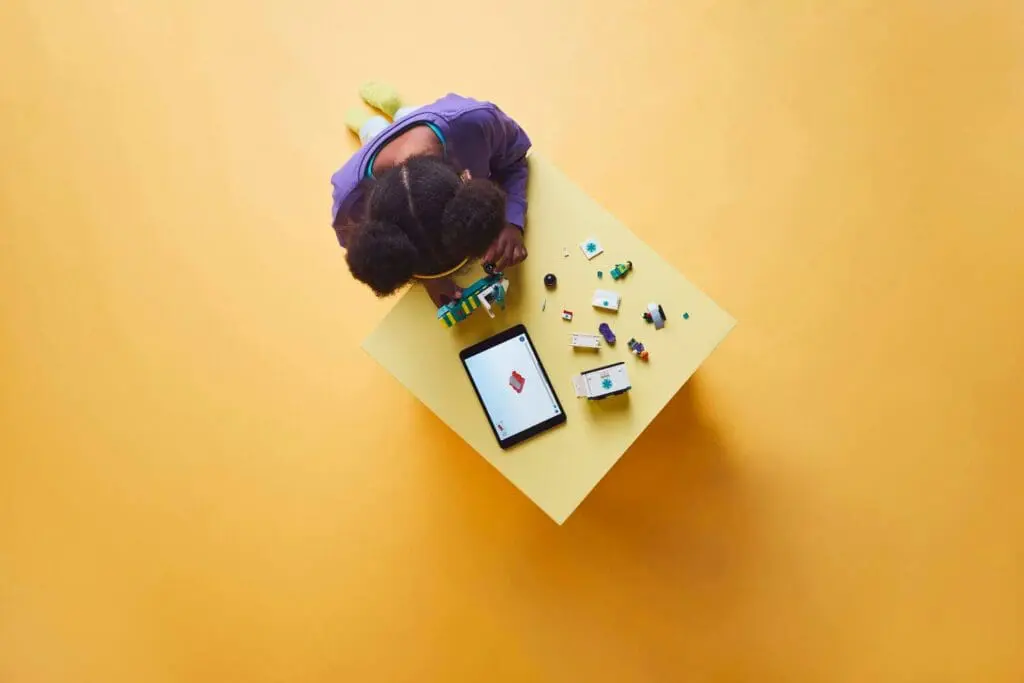 Overhead view of child with toys