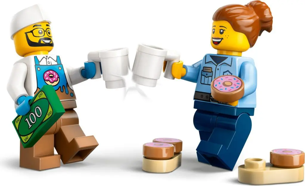 Lego figures toasting with mugs