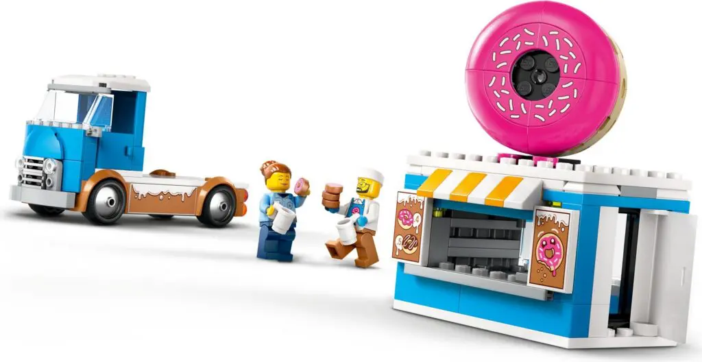 Toy donut shop with truck and figures.