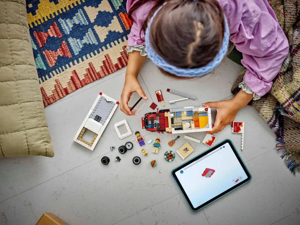 Kid building toy with digital guide