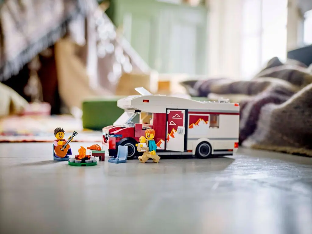 Toy campervan with figures and campfire scene