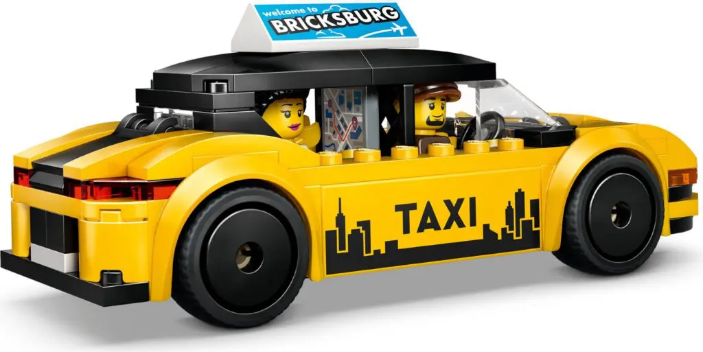 Yellow toy taxi with mini-figures