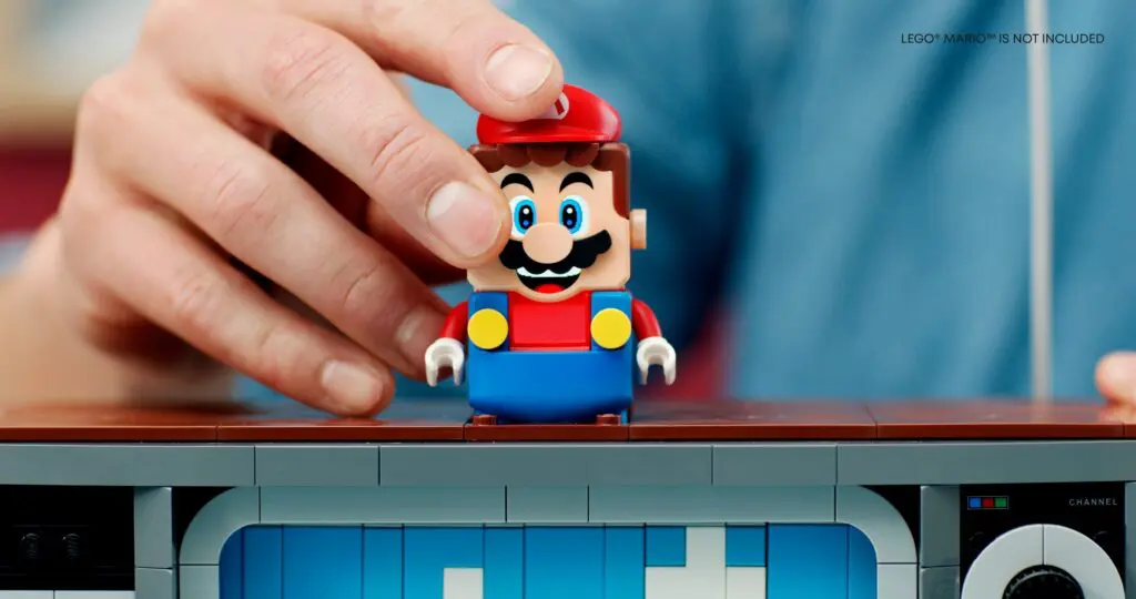 Hand adjusting a Mario LEGO figure