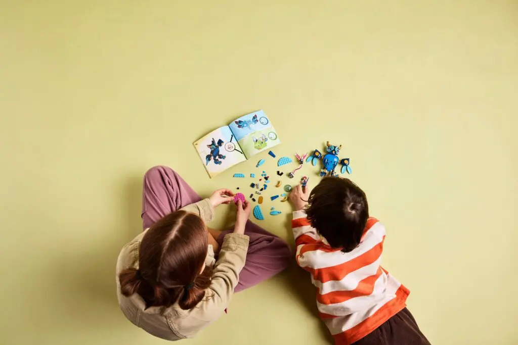 Overhead view of children crafting toys