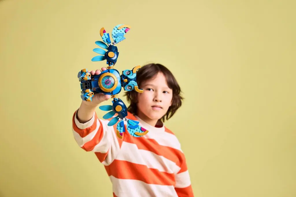 Child holding colorful toy drone