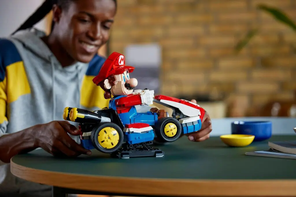 Man enjoying LEGO Mario kart build