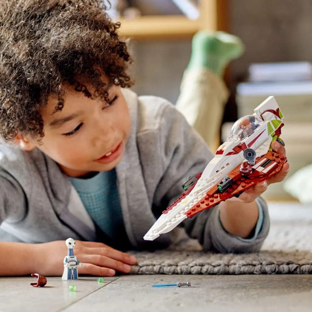Kid enjoying a spaceship toy