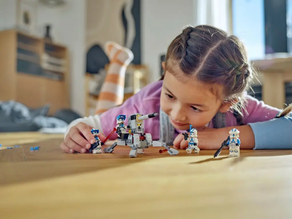 Young girl engaged with robot toys