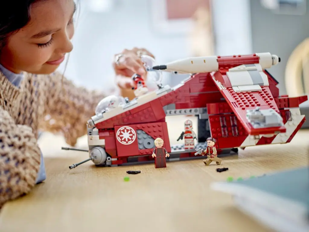 Girl assembling LEGO Star Wars model