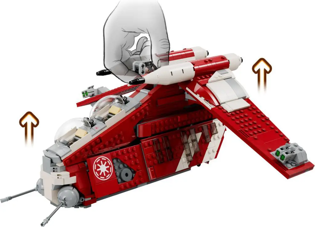 Hand holding red LEGO spacecraft