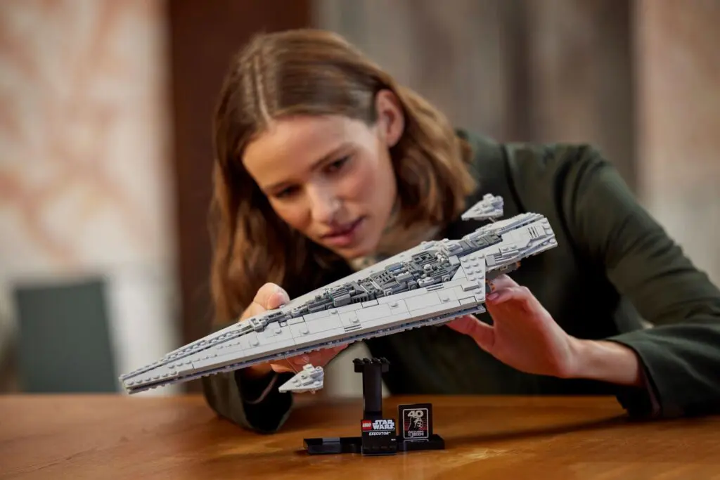 Person examining detailed spaceship model