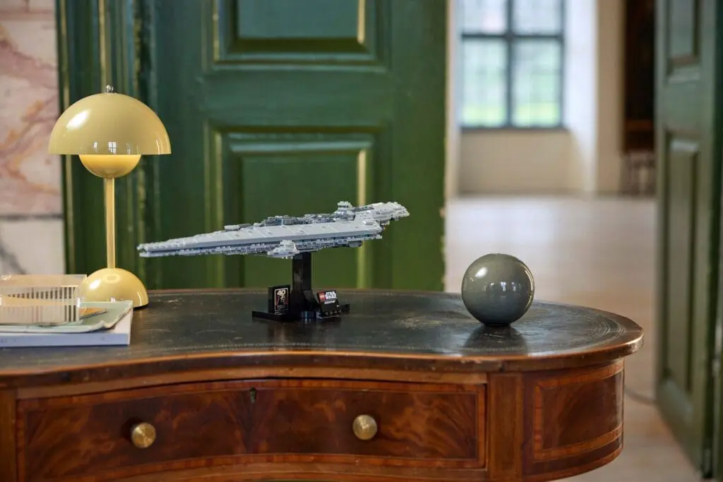 Decorative desk with spaceship and orb