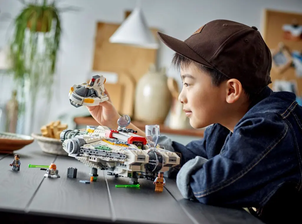 Child playing with spaceship building set
