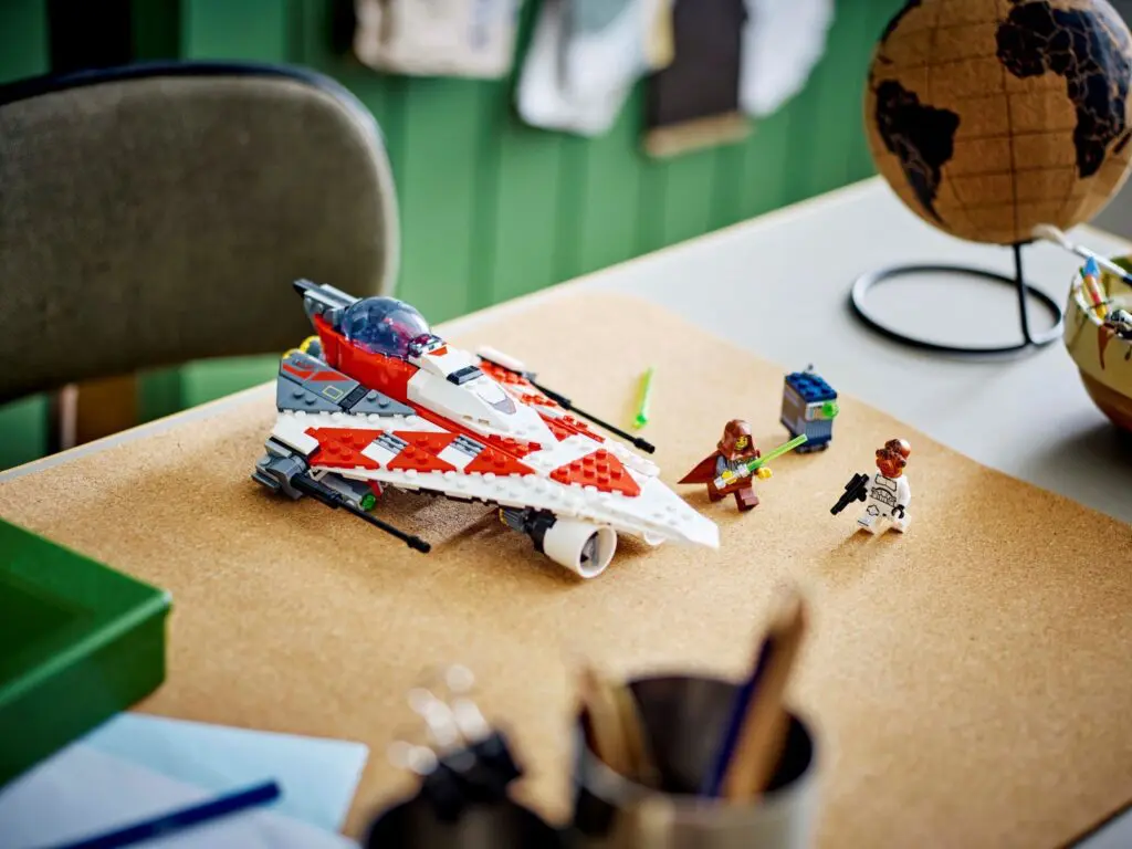 Toy spaceship and figures on desk