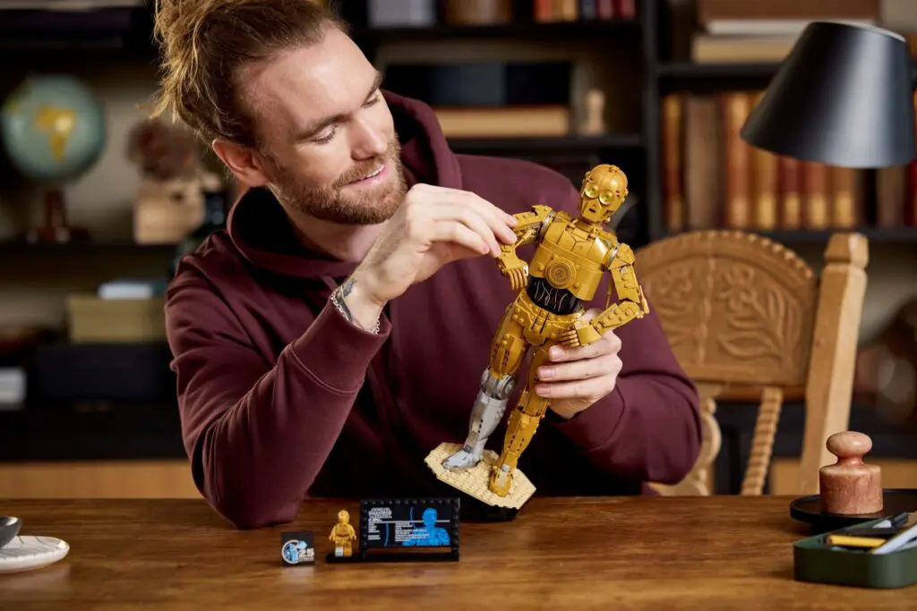 Man assembling a robot model