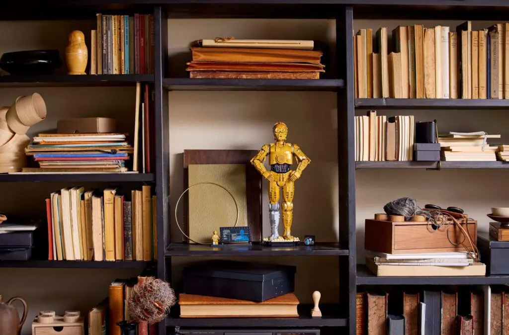 Robot figurine on eclectic bookshelf