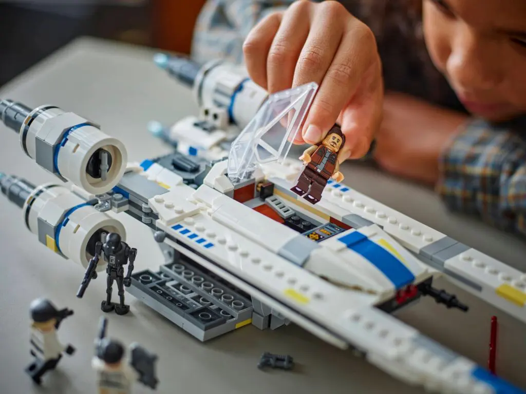 Assembling a spacecraft toy with mini figures