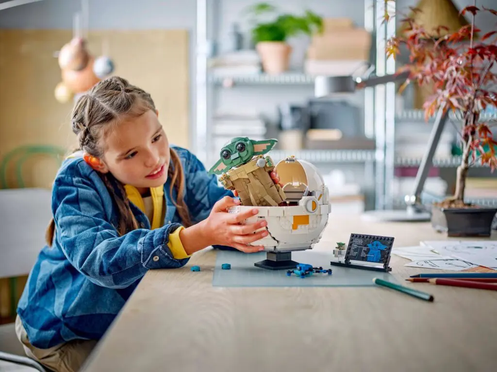 Girl assembling a creative toy set