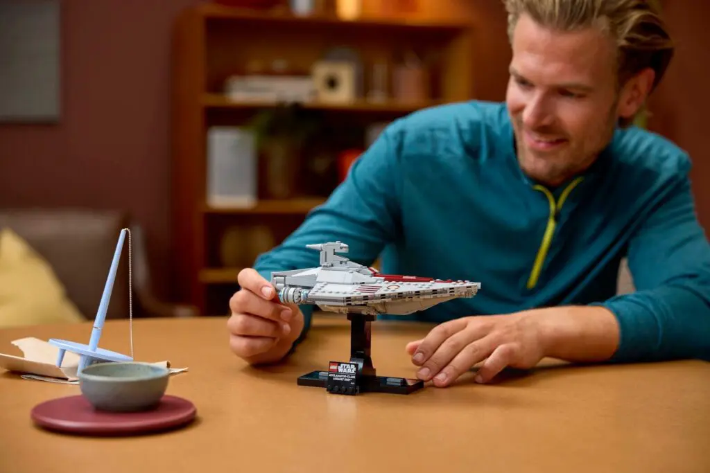 Man assembling spaceship model