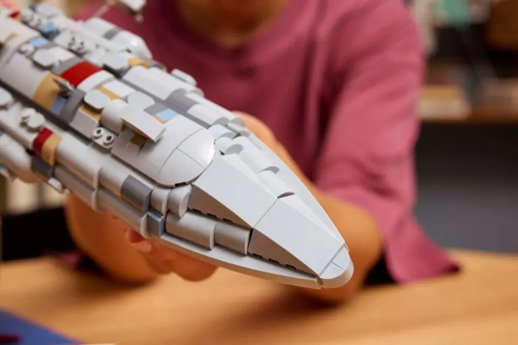 Child assembling a spaceship model