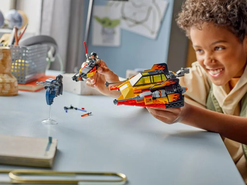 Boy enjoying space-themed toys