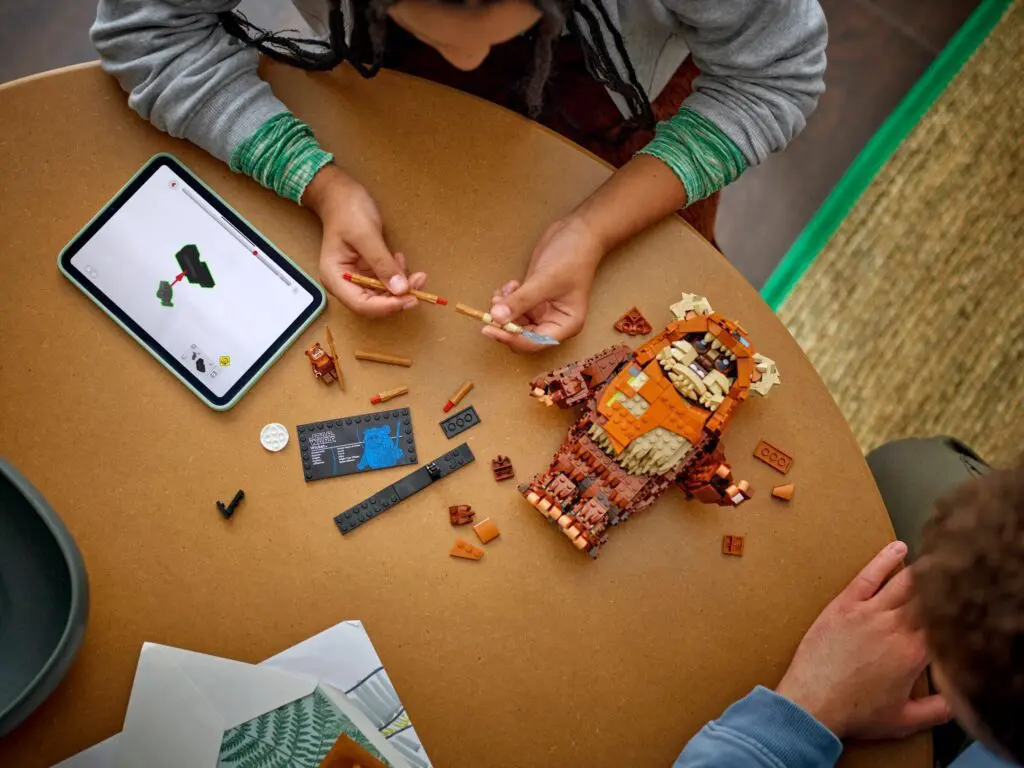 Child assembling LEGO monster creation